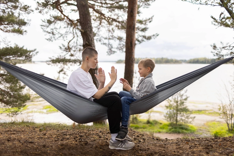 Woman and child in a hanging swing