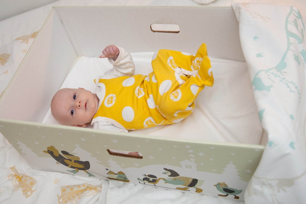 A baby inside a Finnish "baby box."