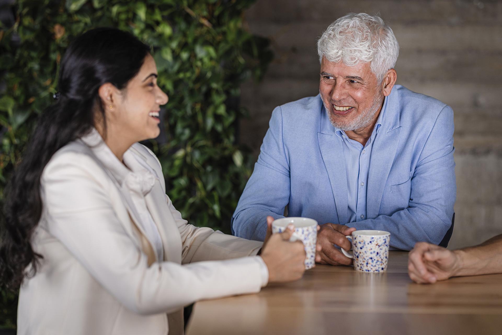 Two people having coffee at work